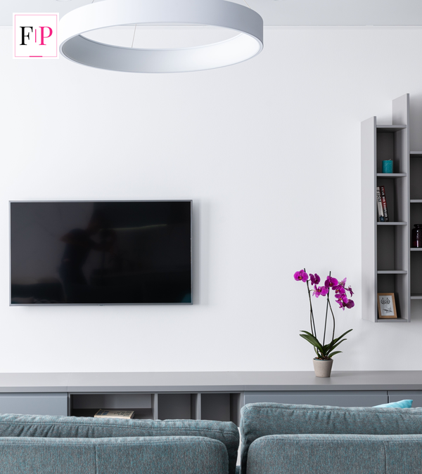 Modern living room with wall-mounted television — Apple event October 2026