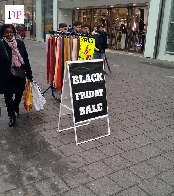 A Black Friday sale poster in a shop window — the early advertising for black friday deals 2026