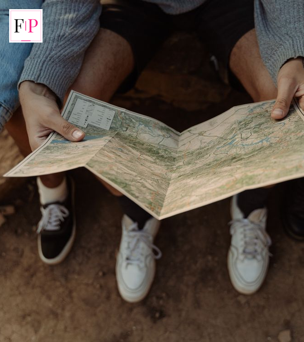 Celebrity Race Across the World 2026: Ultimate Guide & Cast Travellers studying a paper map during Celebrity Race Across the World 2026