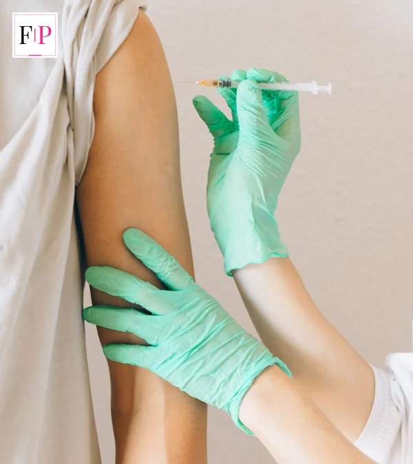 Covid Booster 2026: 7 Essential Facts to Book Fast Close-up of a vaccine being prepared for an arm during the covid booster 2026 programme