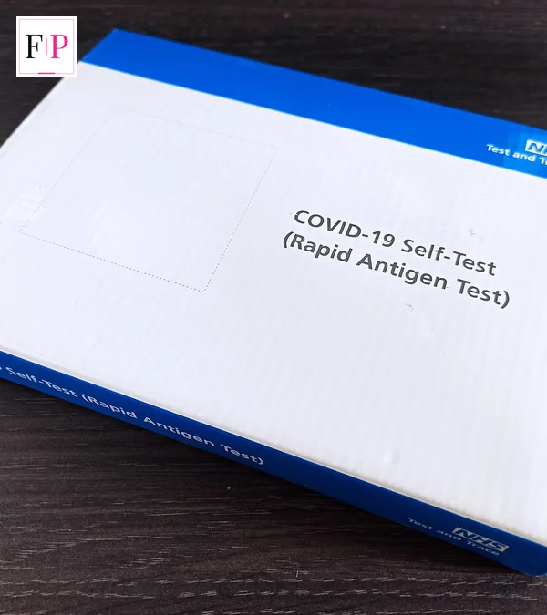 Covid Symptoms 2026: NHS List, Flu Differences & Care An NHS Covid-19 rapid antigen test kit, one way people check covid symptoms 2026 at home