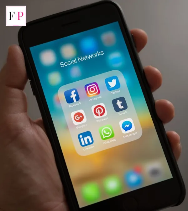 A person holding a smartphone — weighing the iphone 18 release date against buying now