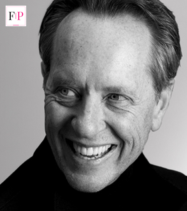 Richard E Grant portrait smiling — the actor at the centre of the Celebrity Traitors storm
