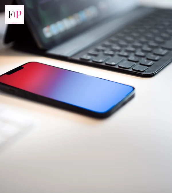 Samsung Galaxy Z Fold 8: Which? Best Buy Verdict Explained A smartphone lying on a desk beside a keyboard — charging and working with the samsung galaxy z fold 8