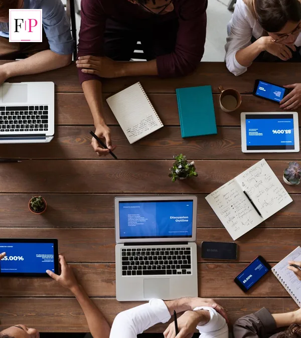Touchscreen MacBook Pro: Reported 27 October Launch An overhead workspace with laptops and a tablet on a wooden table — touchscreen macbook pro reported launch